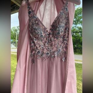 Juniors size 1 prom dress. It is a purplish pink with blue flowers.